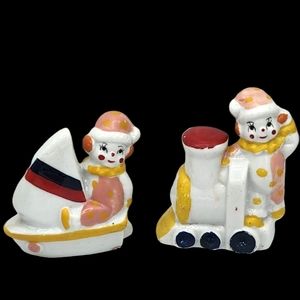 Porcelain Clown Figurines Pair Riding Train and Boat Set of 2